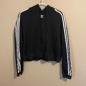 black adidas a little bit cropped hoodie, with lines on the sleeves size medium